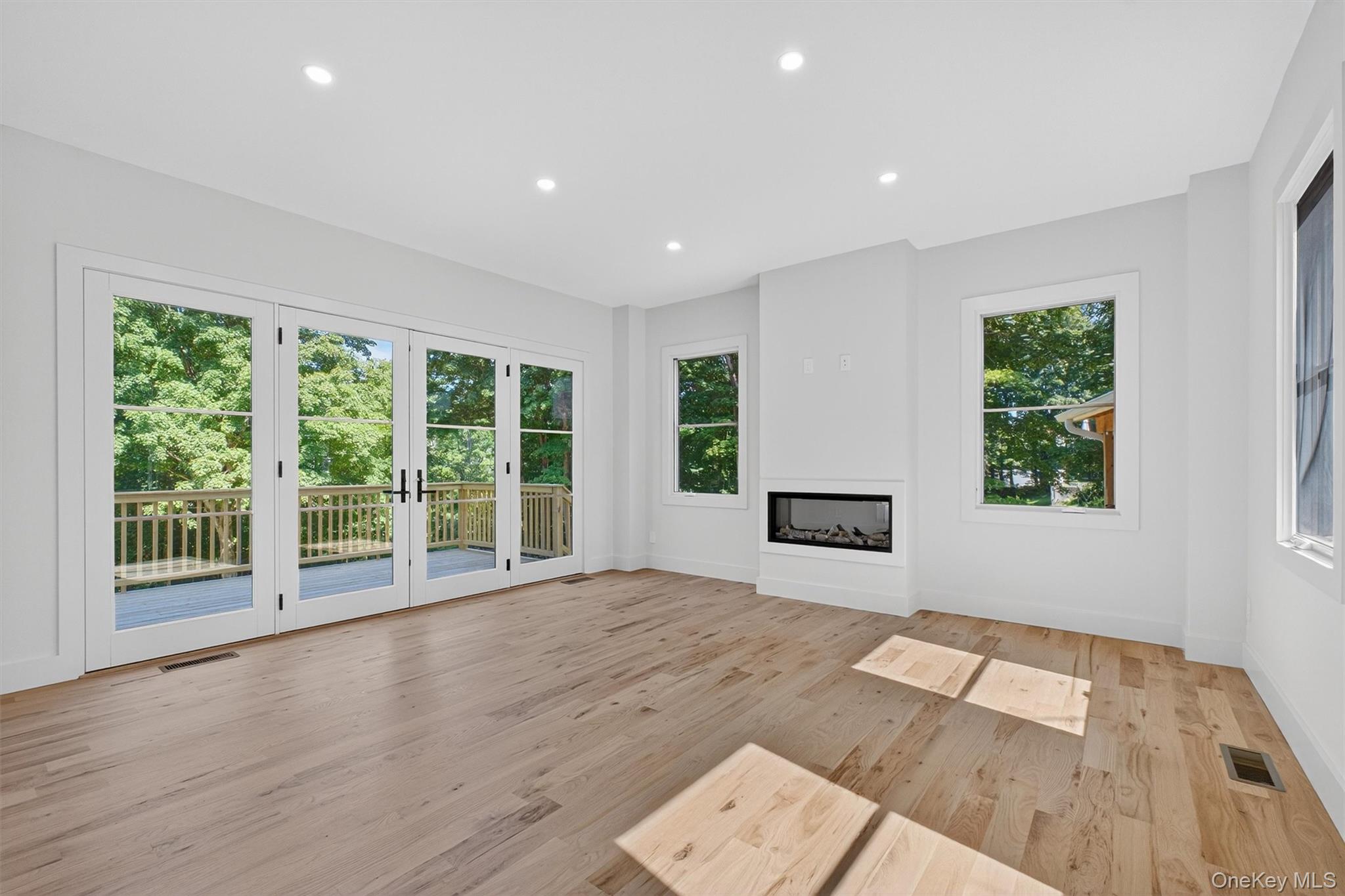 64 Stonehouse Road Somers, NY 10589 - Photo 14 of 48 a view of an empty room with wooden floor and a window