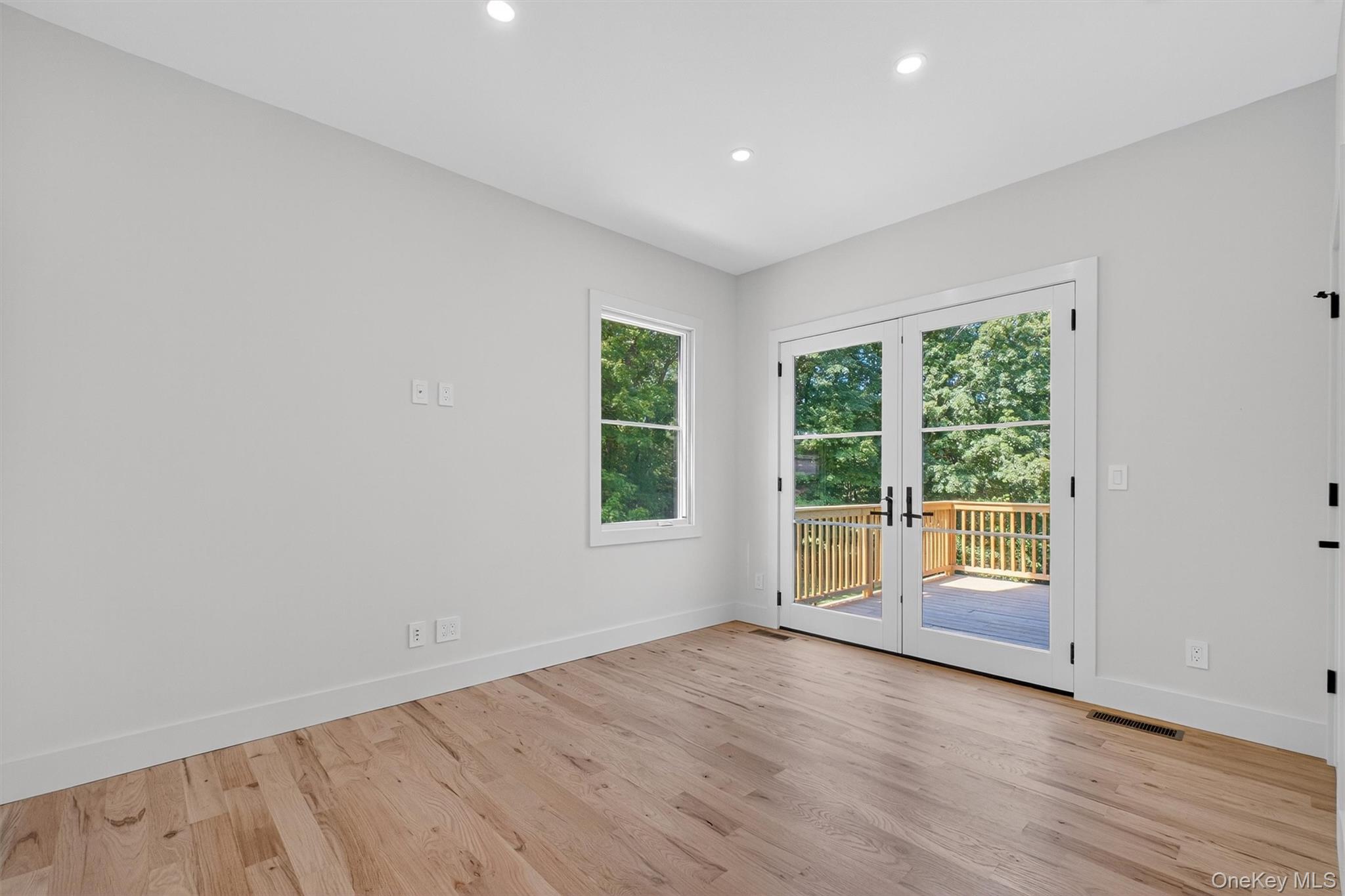 64 Stonehouse Road Somers, NY 10589 - Photo 18 of 48 an empty room with wooden floor and windows