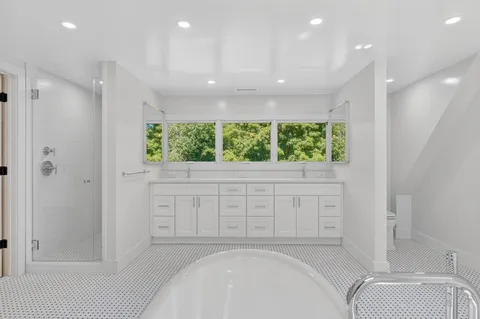 a bathroom with a bathtub and a shower