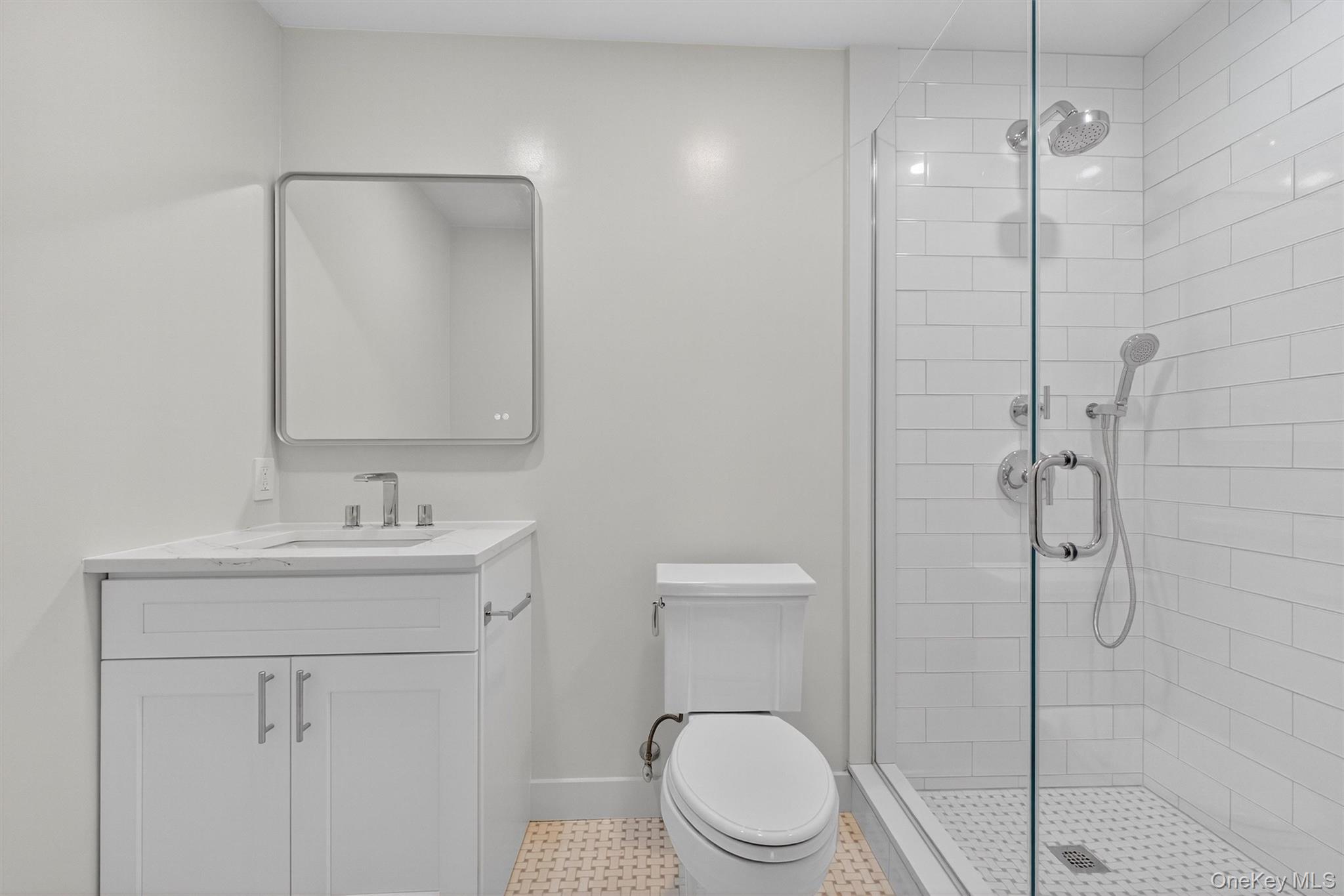 64 Stonehouse Road Somers, NY 10589 - Photo 32 of 48 a bathroom with a toilet a sink a shower and mirror