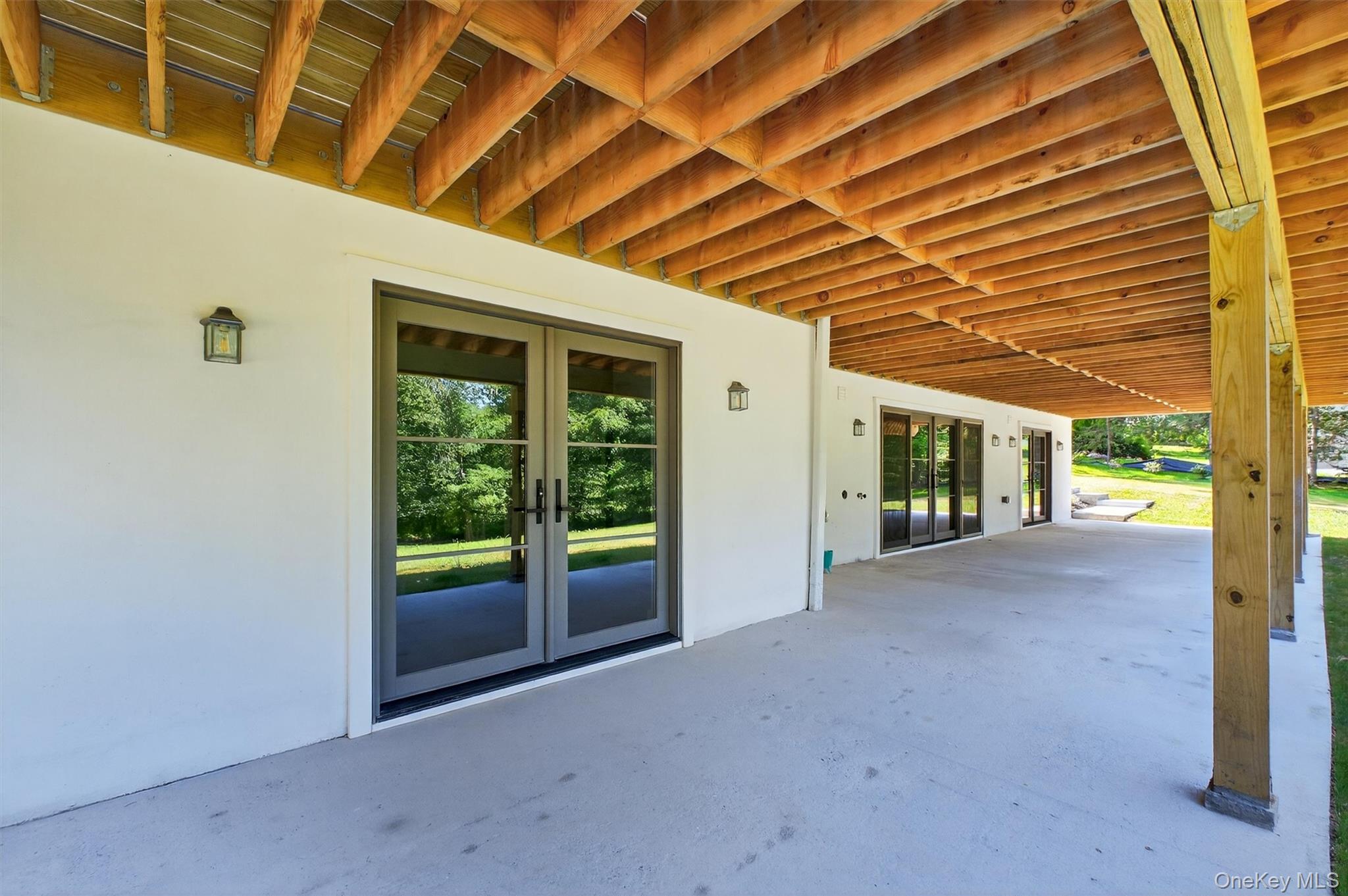 64 Stonehouse Road Somers, NY 10589 - Photo 44 of 48 a view of a porch with a large tree