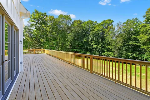 a view of balcony with wooden floor