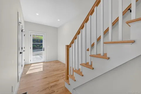 a large kitchen with stainless steel appliances a refrigerator and a stove top oven