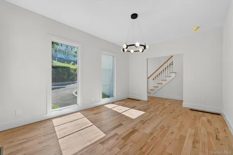 a large kitchen with stainless steel appliances a refrigerator and a sink