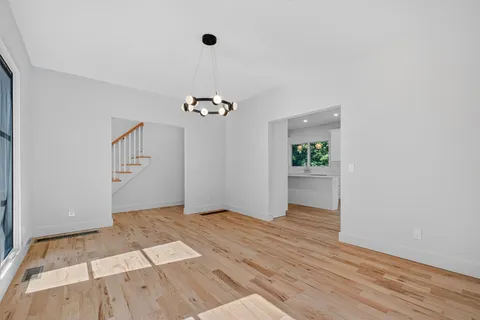 wooden floor in an empty room with a workspace