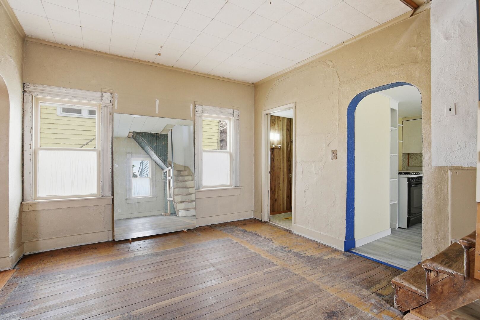 910 18th Avenue Rock Island, IL 61201 - Photo 12 of 30 an empty room with wooden floor and windows