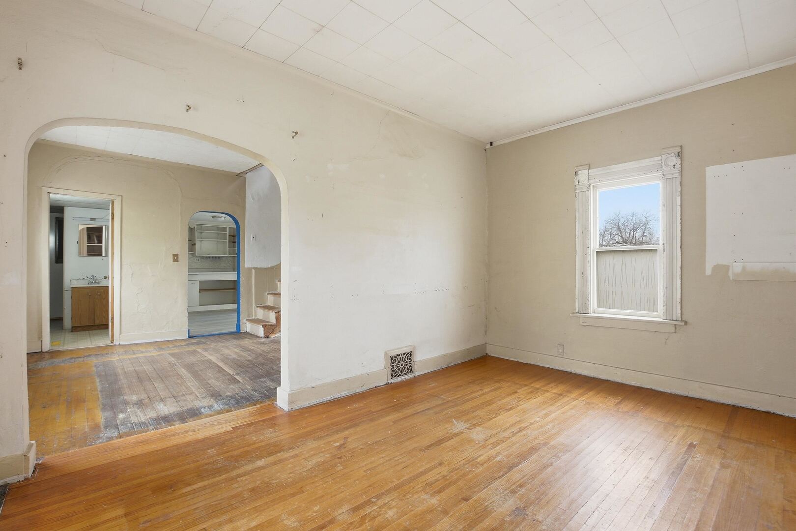 910 18th Avenue Rock Island, IL 61201 - Photo 17 of 30 an empty room with wooden floor and windows