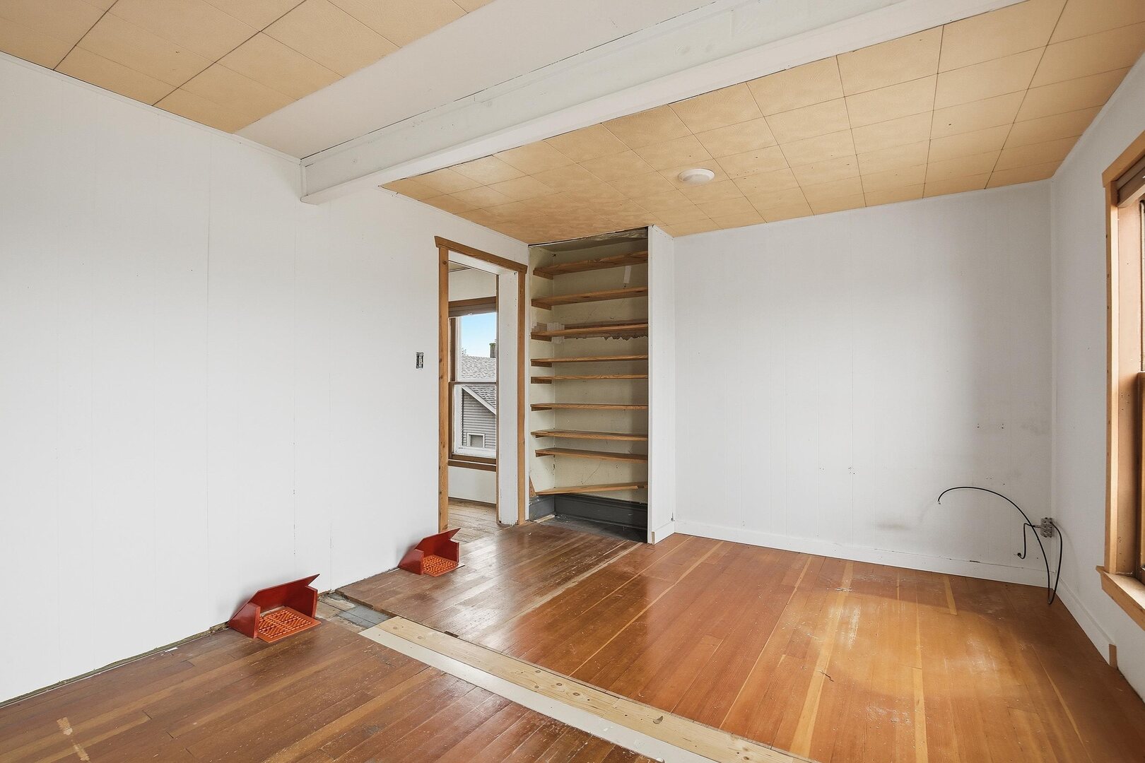 910 18th Avenue Rock Island, IL 61201 - Photo 22 of 30 a view of a room with wooden floor and closet