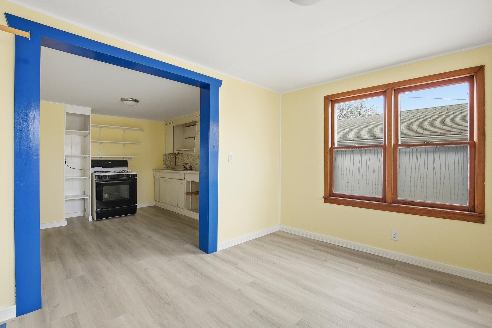 910 18th Avenue Rock Island, IL 61201 - Photo 4 of 30 a view of a kitchen with wooden floor and a kitchen