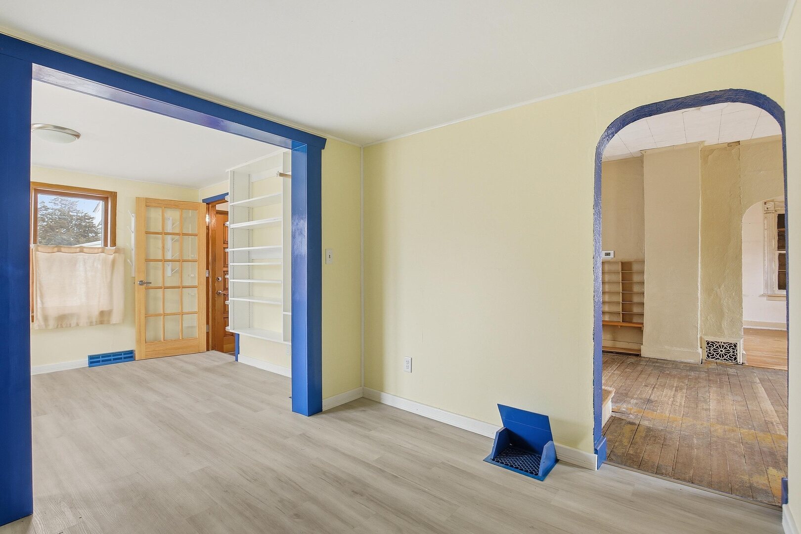 910 18th Avenue Rock Island, IL 61201 - Photo 8 of 30 a view of an empty room with wooden floor and a window