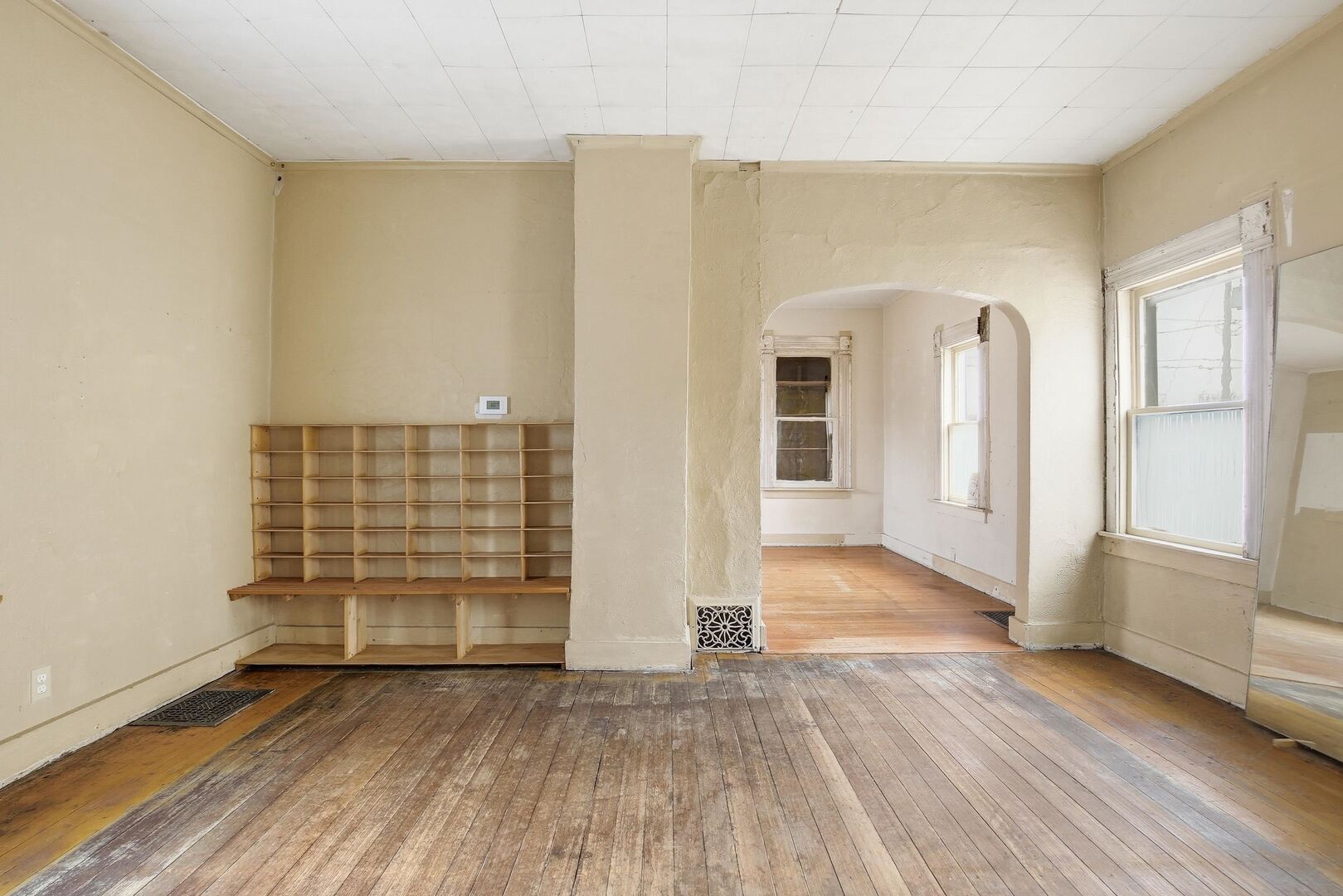 910 18th Avenue Rock Island, IL 61201 - Photo 10 of 30 an empty room with wooden floor and windows
