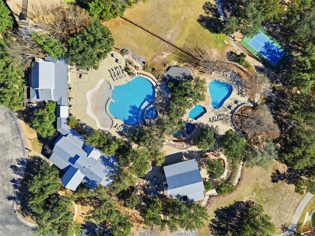 an aerial view of residential house with outdoor space and swimming pool