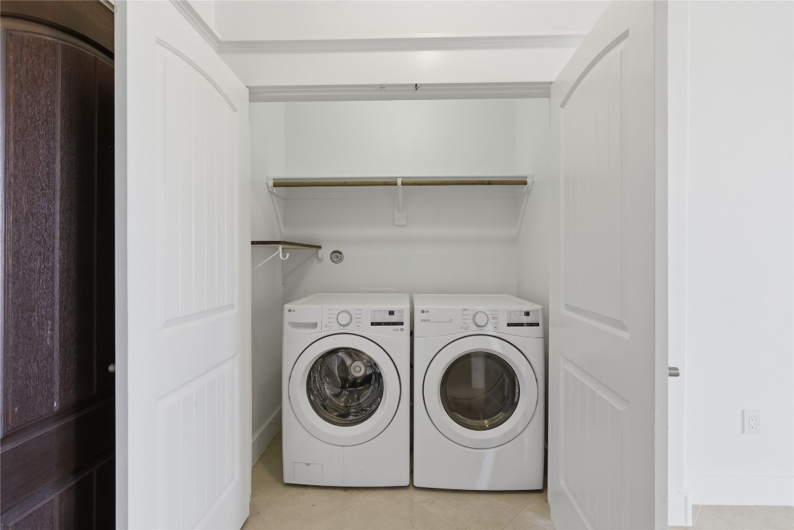 17700 Edgewood Way, Unit 101 Jonestown, TX 78645 - Photo 17 of 40 a utility room with dryer and washer