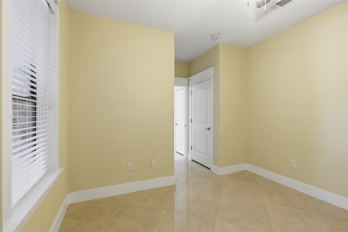 17700 Edgewood Way, Unit 101 Jonestown, TX 78645 - Photo 19 of 40 Unfurnished room featuring plenty of natural light
