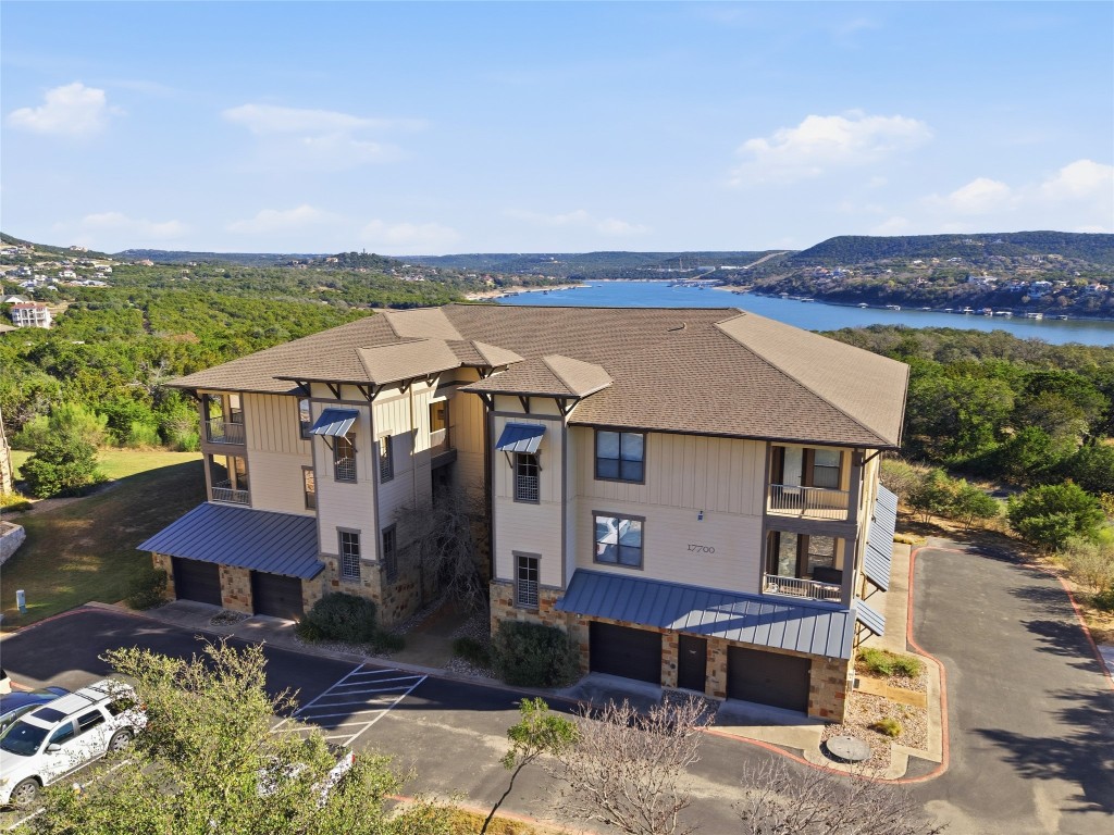 17700 Edgewood Way, Unit 101 Jonestown, TX 78645 - Photo 2 of 40 an aerial view of a house with a yard garage and a patio