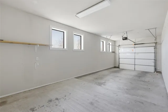 a front view of a house with a garage