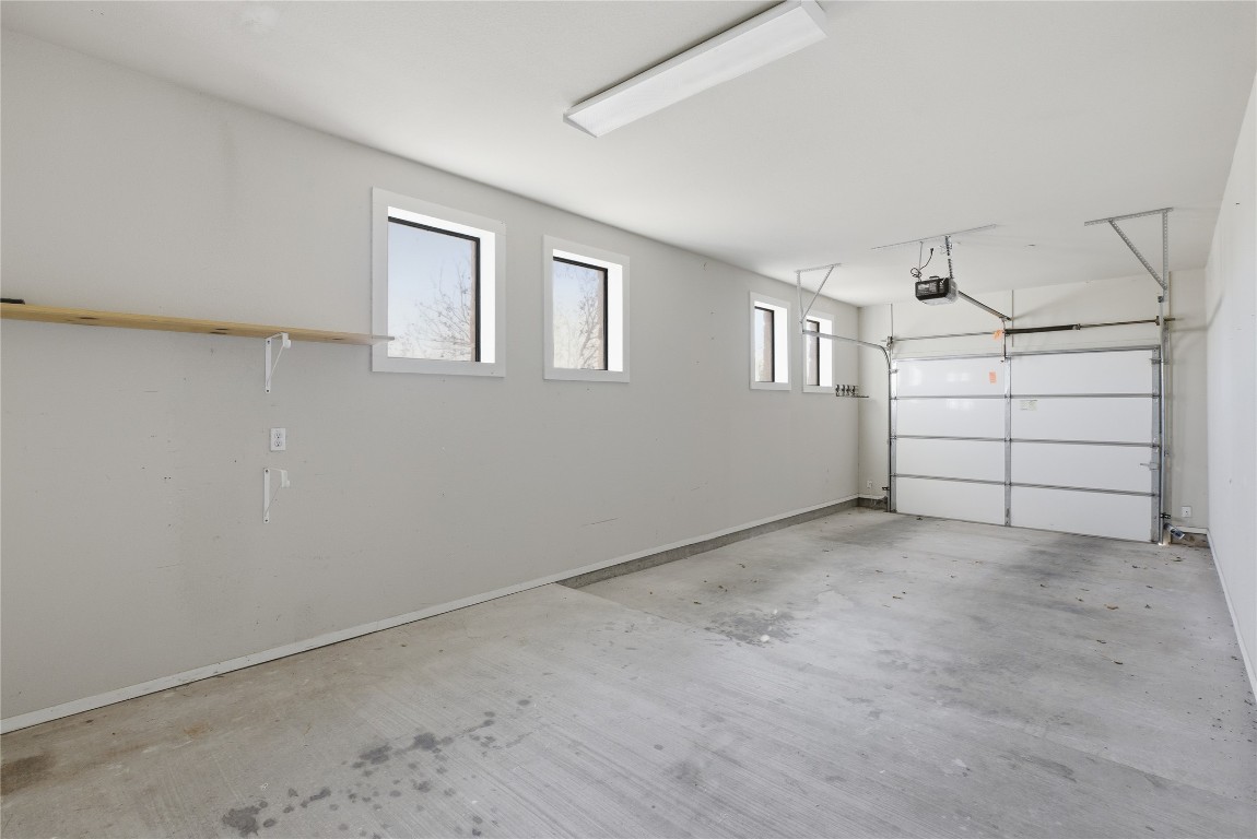 17700 Edgewood Way, Unit 101 Jonestown, TX 78645 - Photo 23 of 40 Garage with space for golf cart or work area