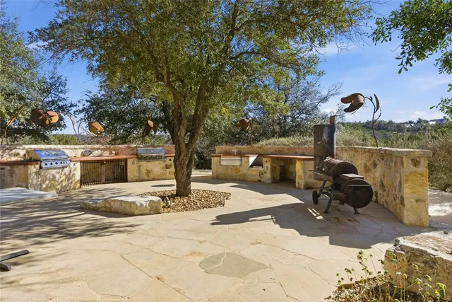 an aerial view of a houses with a yard