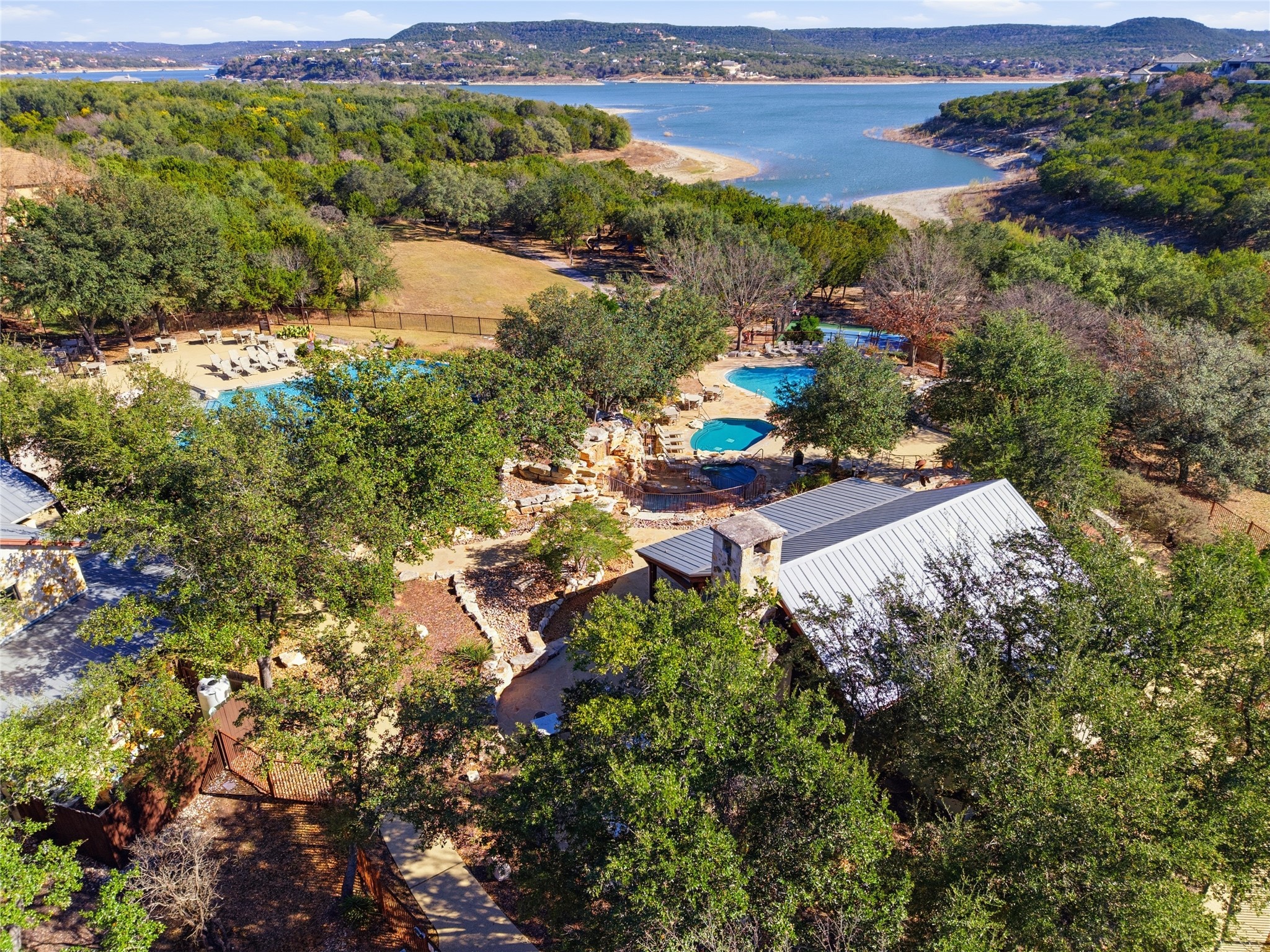 17700 Edgewood Way, Unit 101 Jonestown, TX 78645 - Photo 32 of 40 an aerial view of a houses with a yard