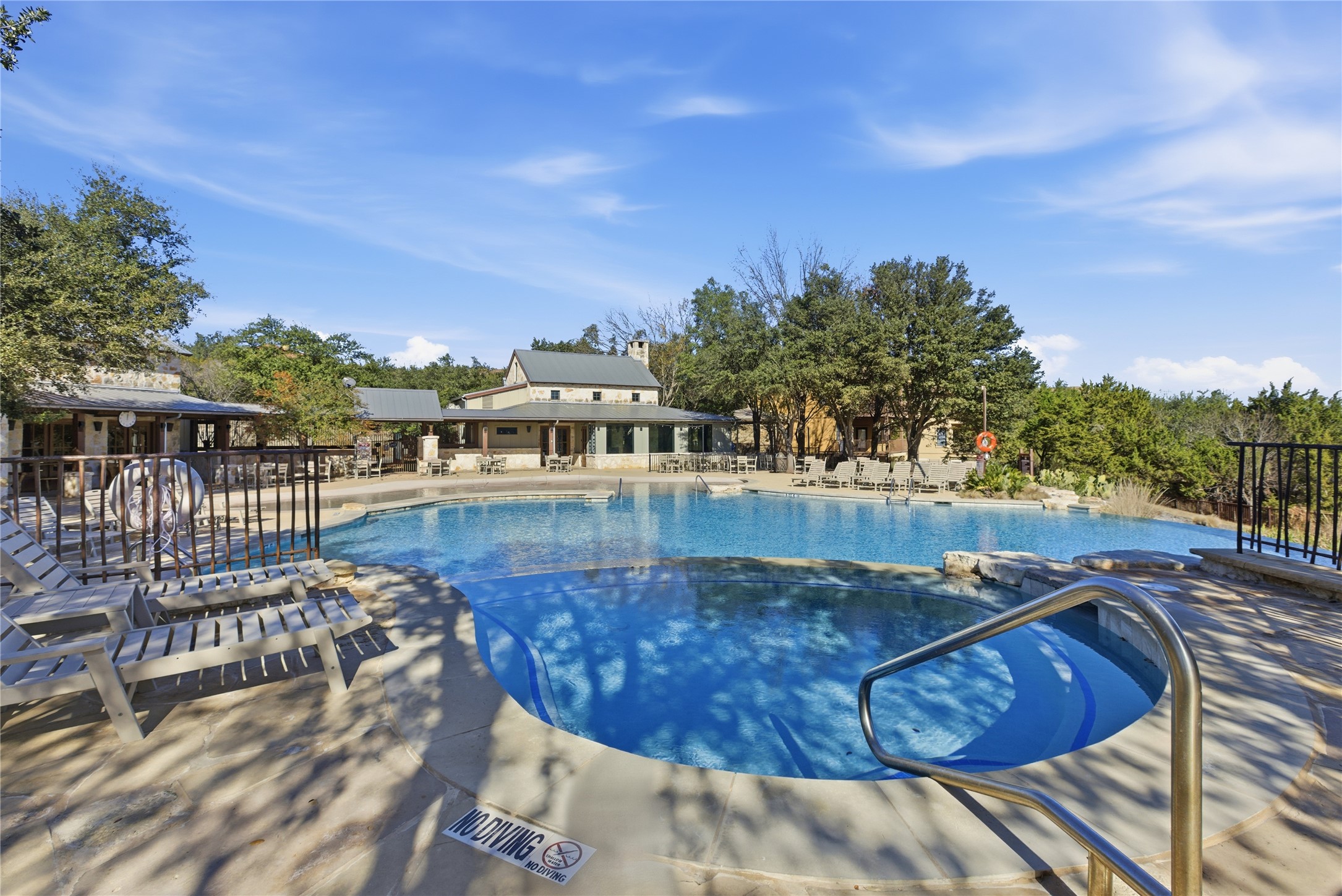 17700 Edgewood Way, Unit 101 Jonestown, TX 78645 - Photo 35 of 40 a view of a swimming pool with an outdoor seating