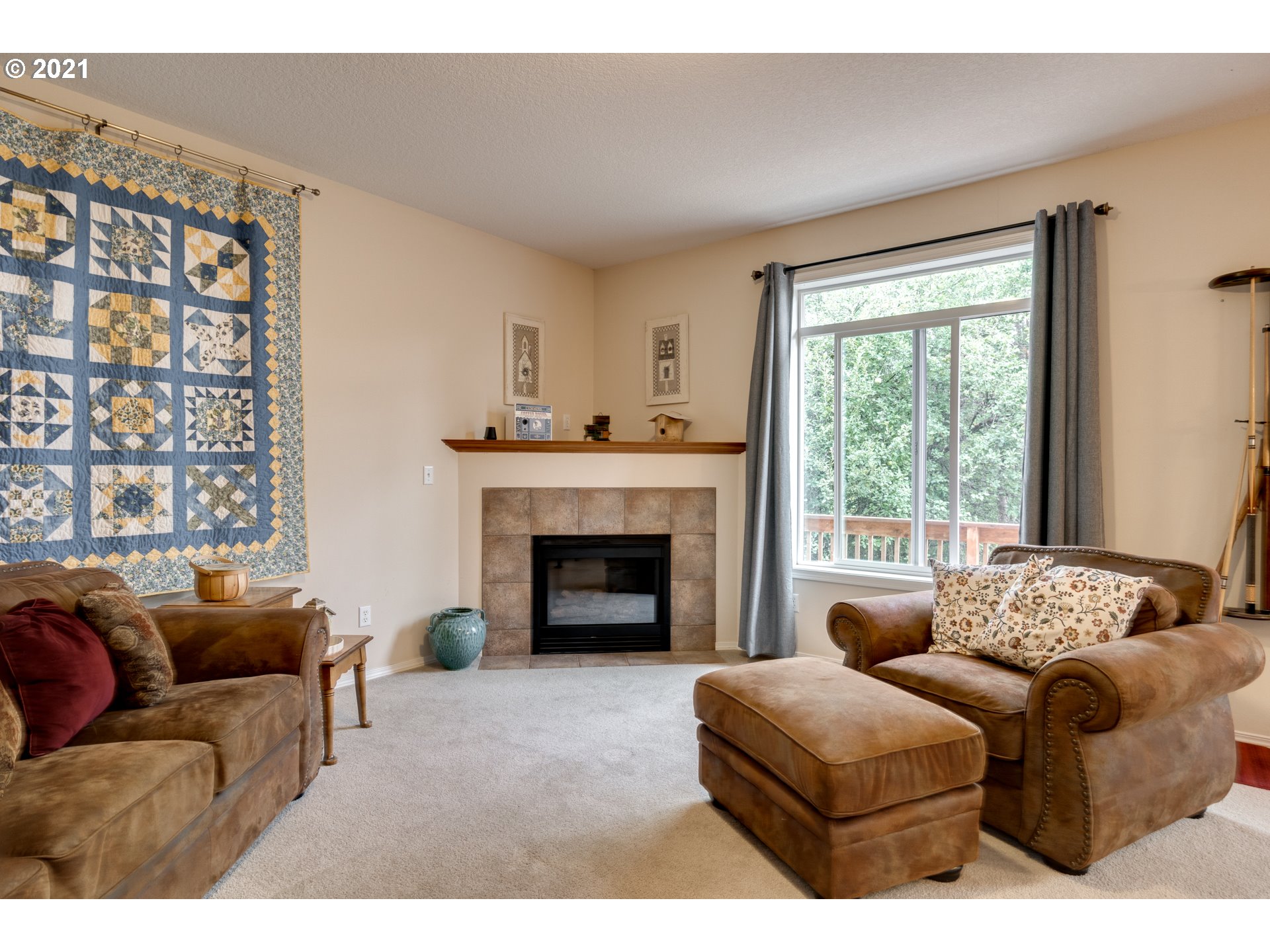 295 South Hillhurst Road Ridgefield, WA 98642 - Photo 11 of 32 a living room with furniture and a fireplace