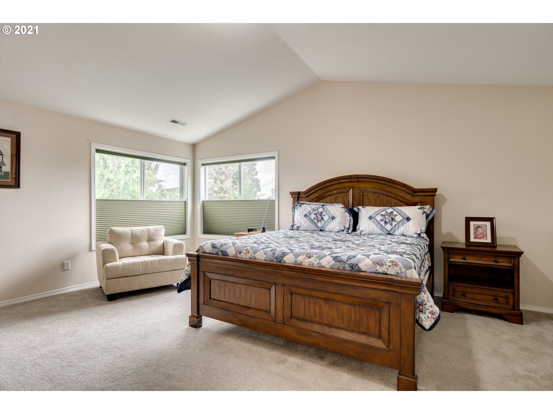 295 South Hillhurst Road Ridgefield, WA 98642 - Photo 12 of 32 a bedroom with a bed and a couch