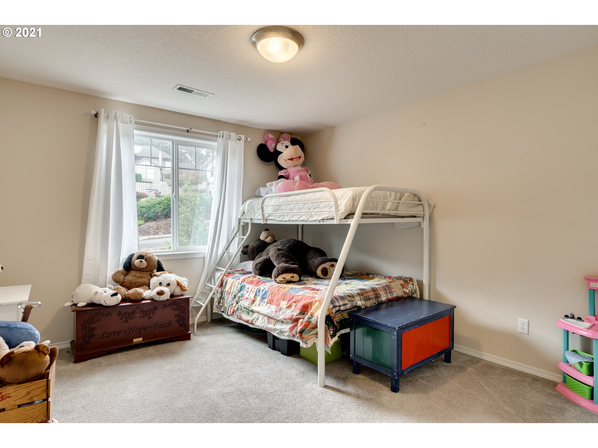 295 South Hillhurst Road Ridgefield, WA 98642 - Photo 14 of 32 a bedroom with furniture and a window