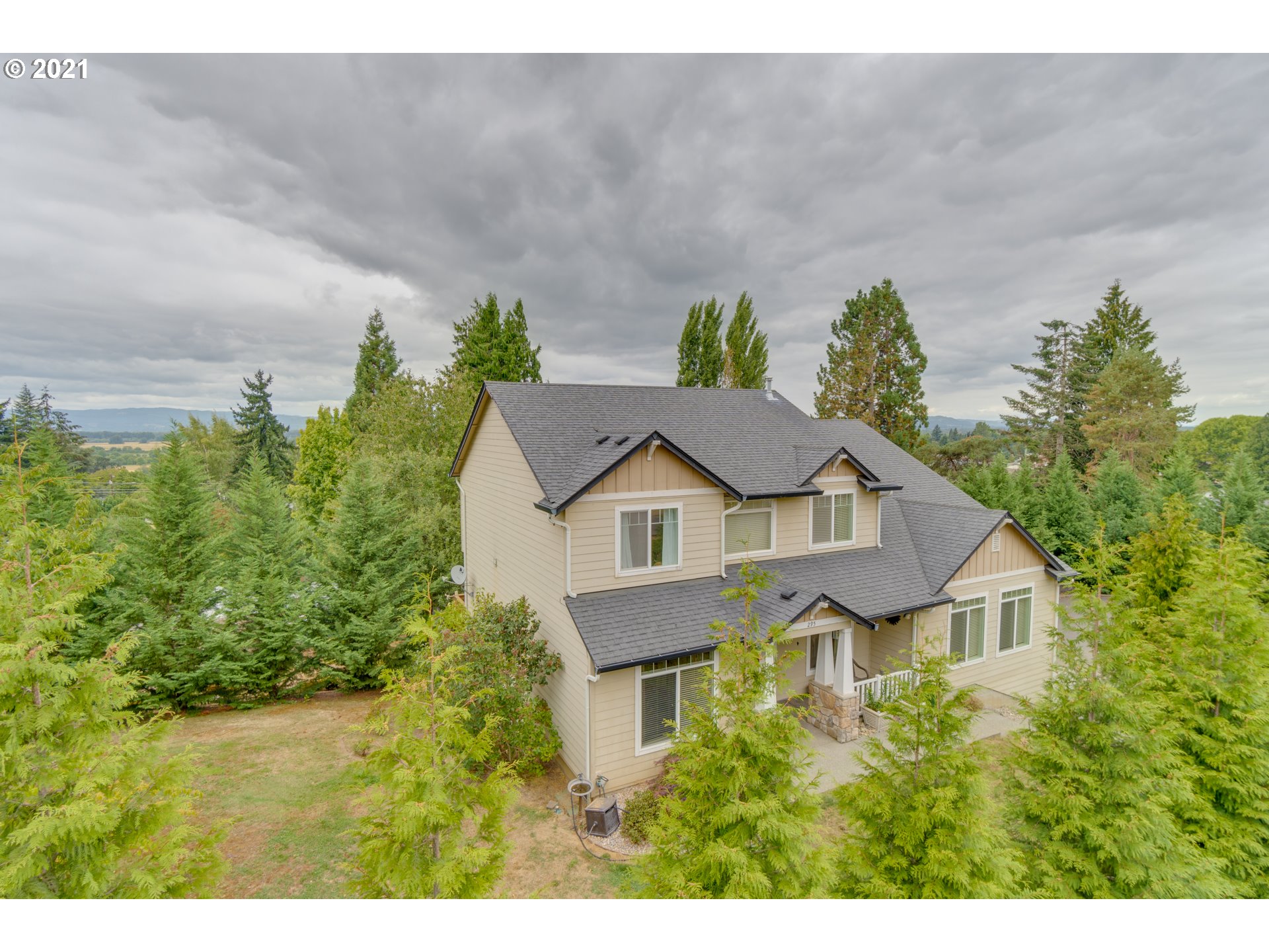295 South Hillhurst Road Ridgefield, WA 98642 - Photo 2 of 32 a view of a house with a yard and plants