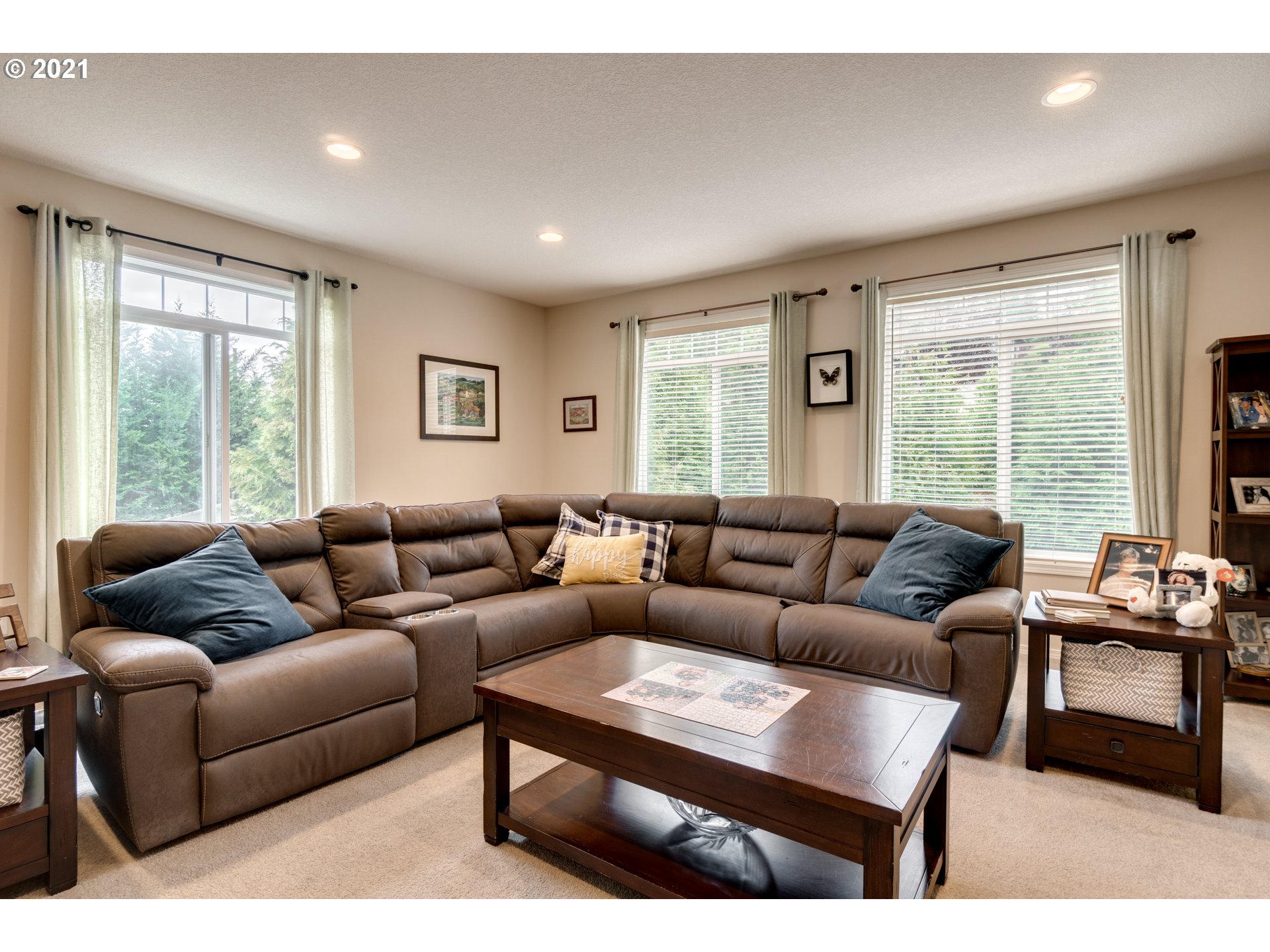 295 South Hillhurst Road Ridgefield, WA 98642 - Photo 6 of 32 a living room with furniture and large windows