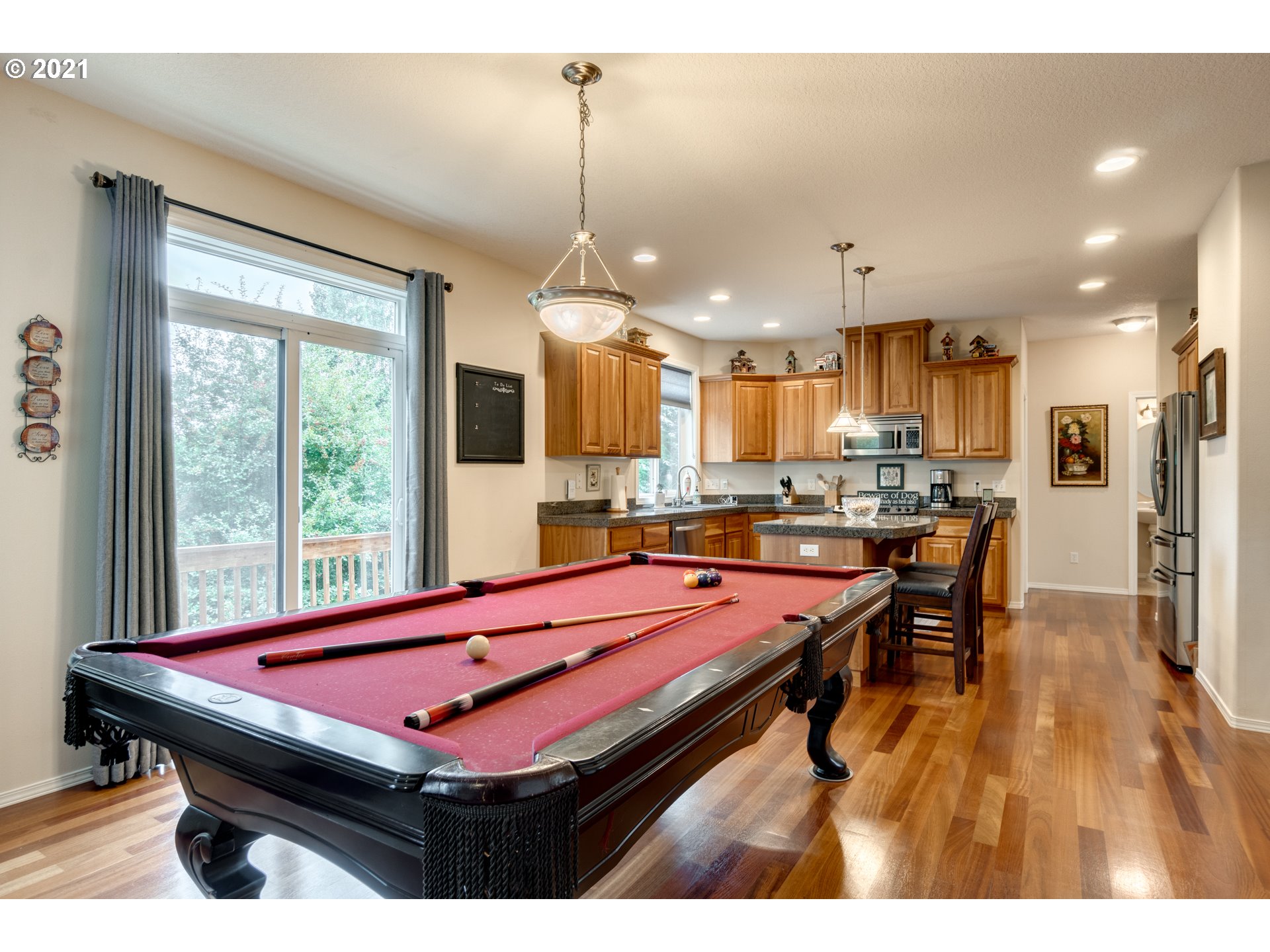 295 South Hillhurst Road Ridgefield, WA 98642 - Photo 9 of 32 a room with pool table and windows