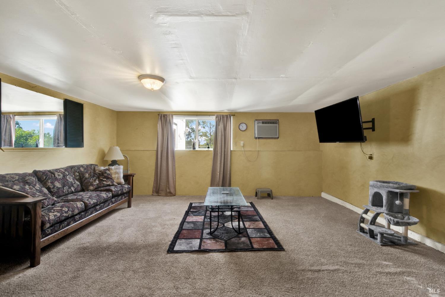 4851 Udell Road Vacaville, CA 95688 - Photo 39 of 65 a bedroom with furniture and a flat screen tv