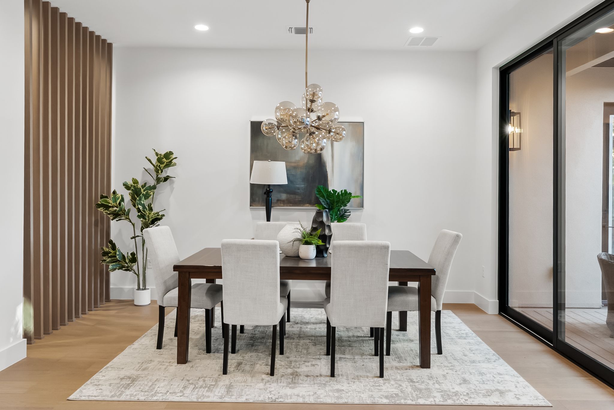 1607 Rabb Road Austin, TX 78704 - Photo 13 of 40 Dining room with light wood finished floors and a chandelier