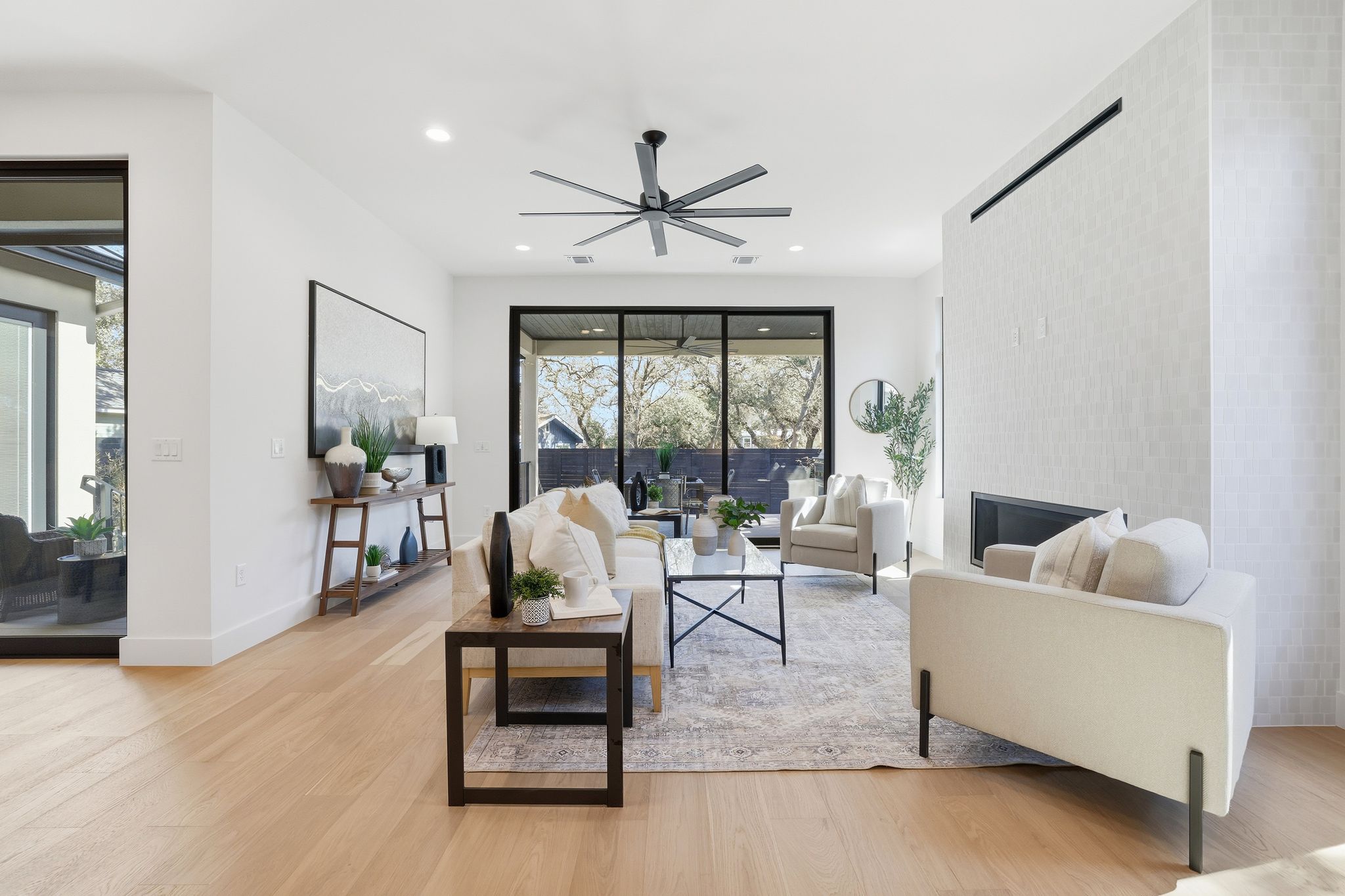 1607 Rabb Road Austin, TX 78704 - Photo 15 of 40 Living area with light wood-style floors, ceiling fan, a fireplace, and recessed lighting