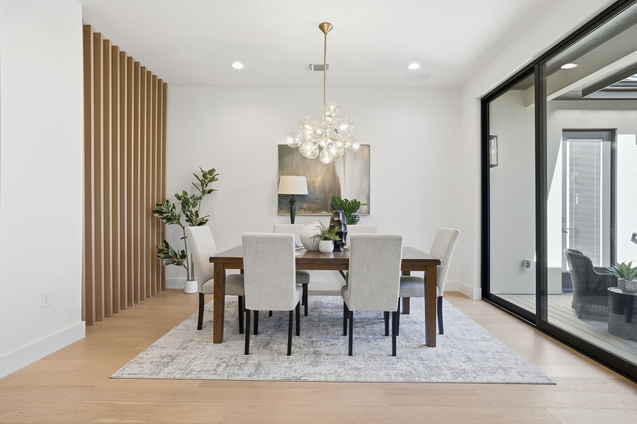1607 Rabb Road Austin, TX 78704 - Photo 16 of 40 Dining space with light wood finished floors and a chandelier