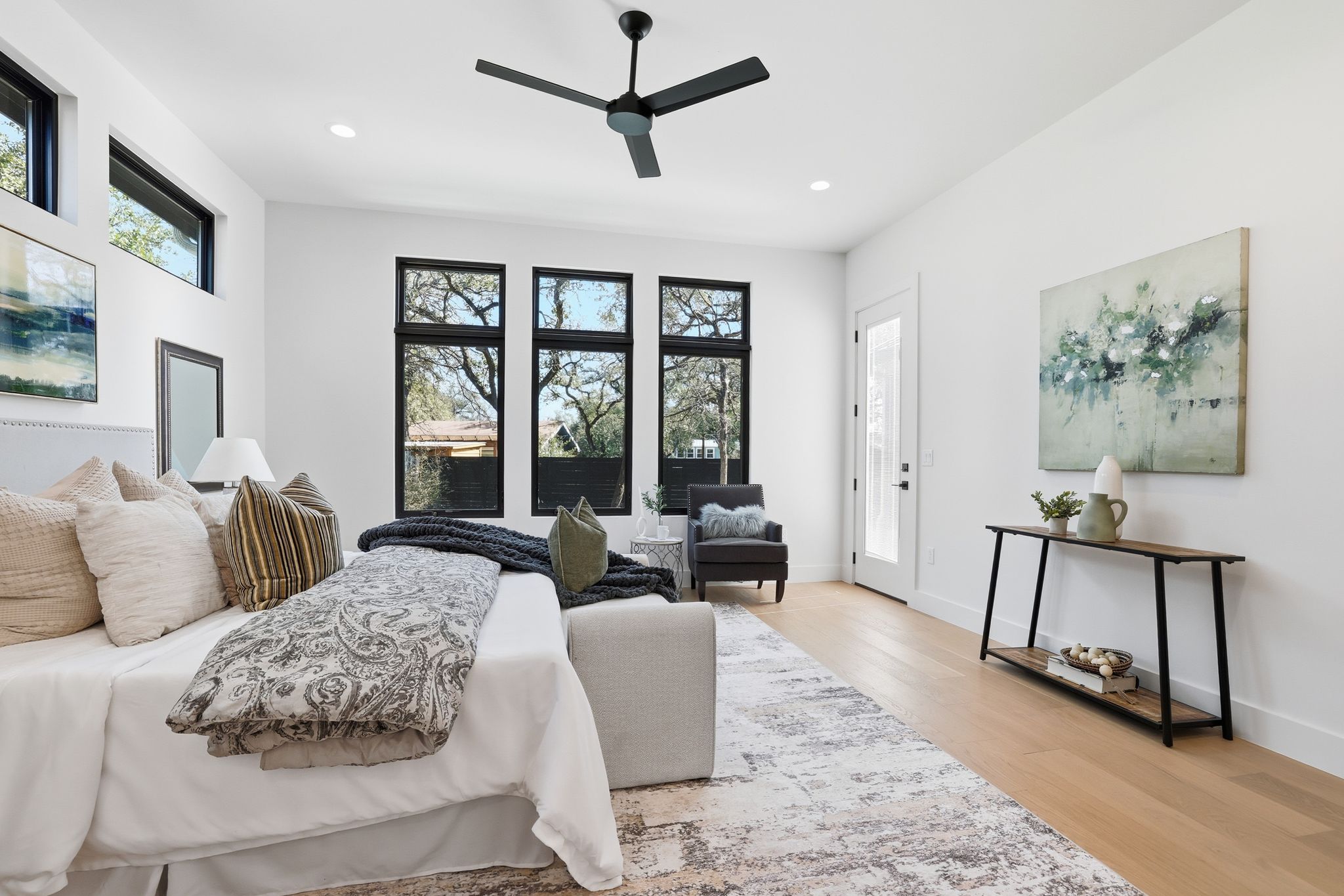 1607 Rabb Road Austin, TX 78704 - Photo 18 of 40 Bedroom featuring access to outside, light wood finished floors, ceiling fan, and recessed lighting