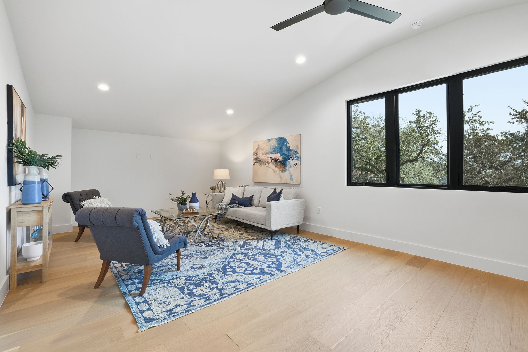 1607 Rabb Road Austin, TX 78704 - Photo 24 of 40 Living area with light wood-style floors, vaulted ceiling, a ceiling fan, and recessed lighting