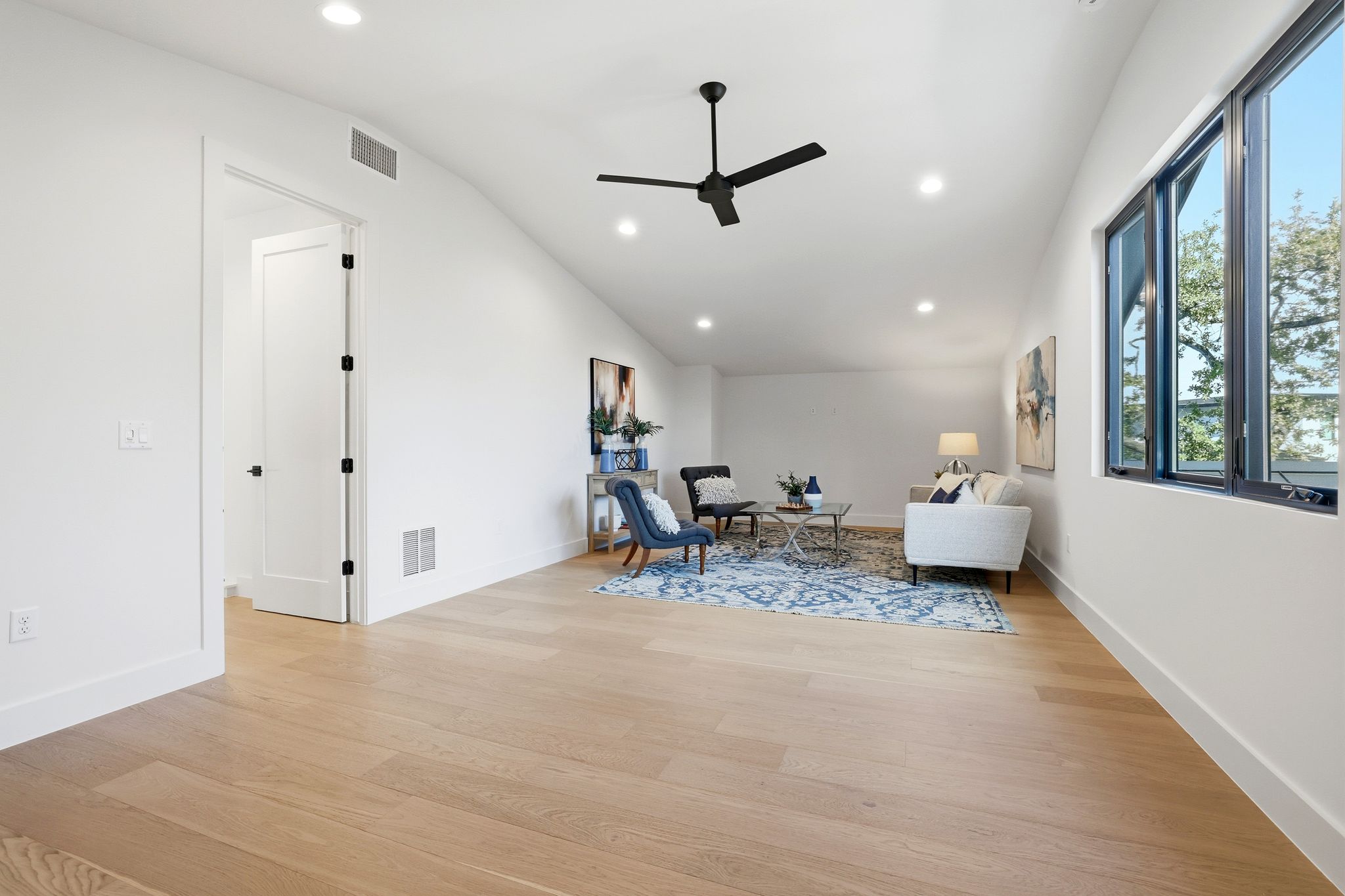 1607 Rabb Road Austin, TX 78704 - Photo 25 of 40 Living area featuring ceiling fan, light wood finished floors, recessed lighting, and vaulted ceiling