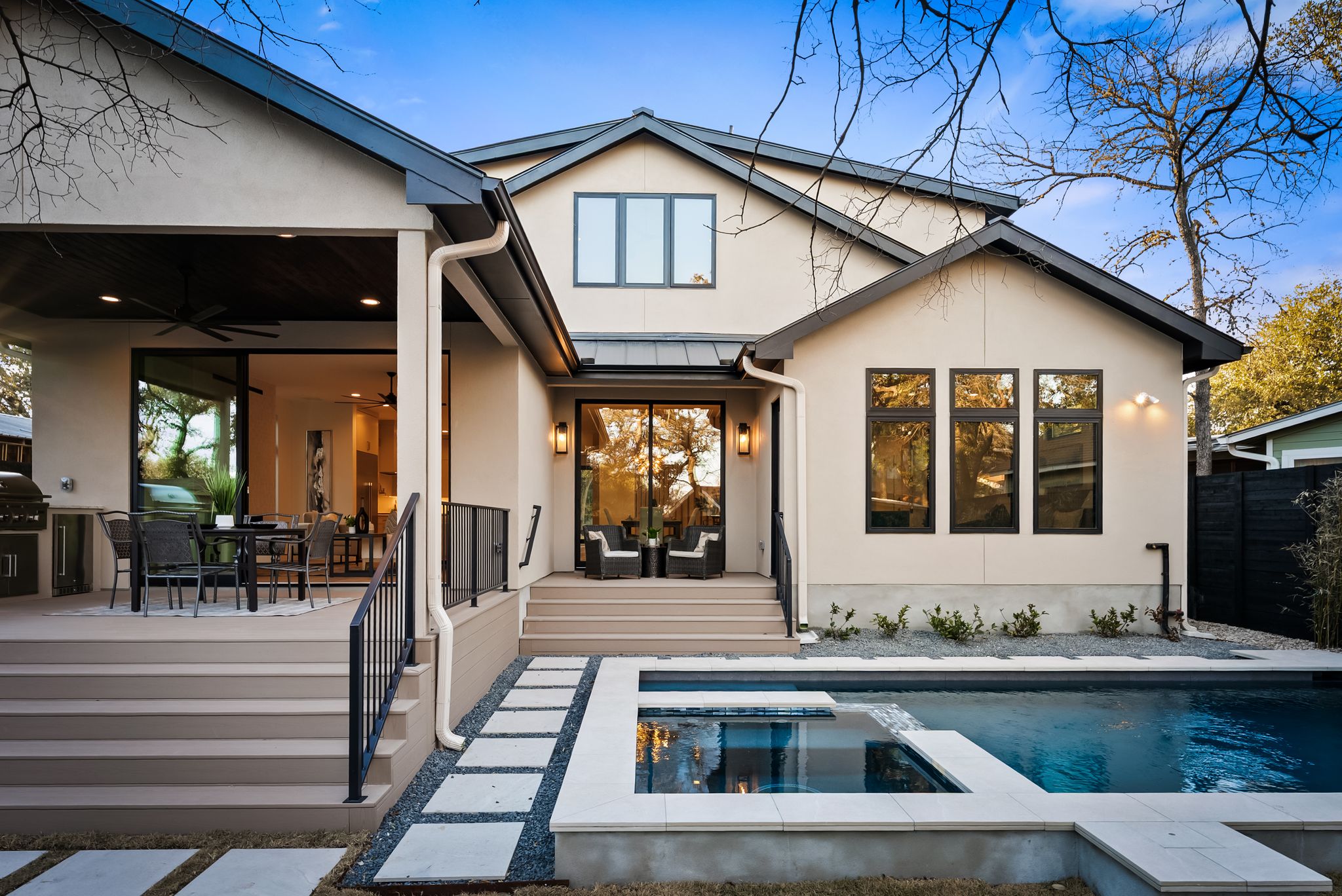 1607 Rabb Road Austin, TX 78704 - Photo 32 of 40 Back of property with a patio, a standing seam roof, outdoor dining area, ceiling fan, and stucco siding