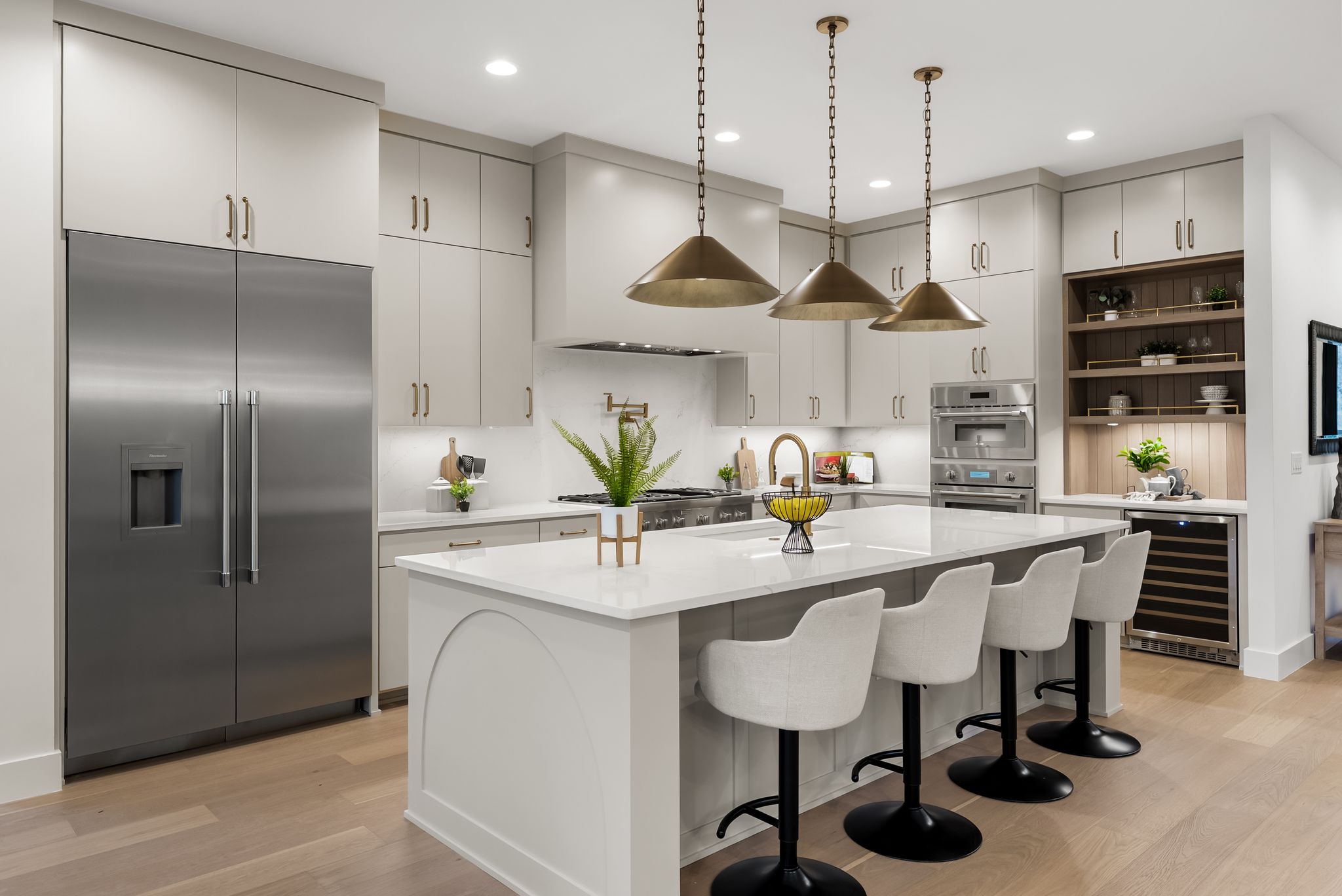 1607 Rabb Road Austin, TX 78704 - Photo 9 of 40 Kitchen with stainless steel appliances, light wood finished floors, beverage cooler, pendant lighting, and open shelves