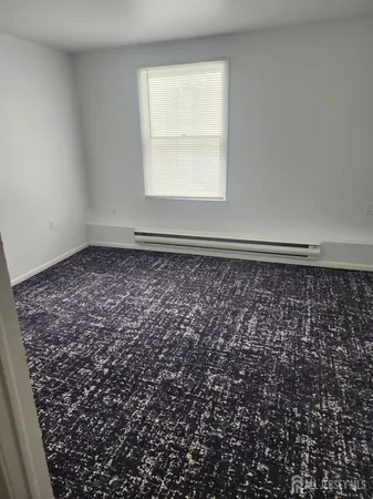 an empty room with a bench