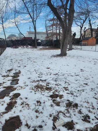 a view of a yard covered with snow