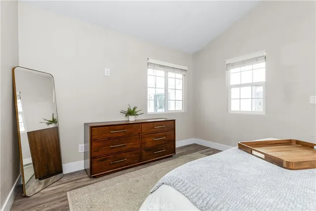 a bedroom with a bed and a dresser