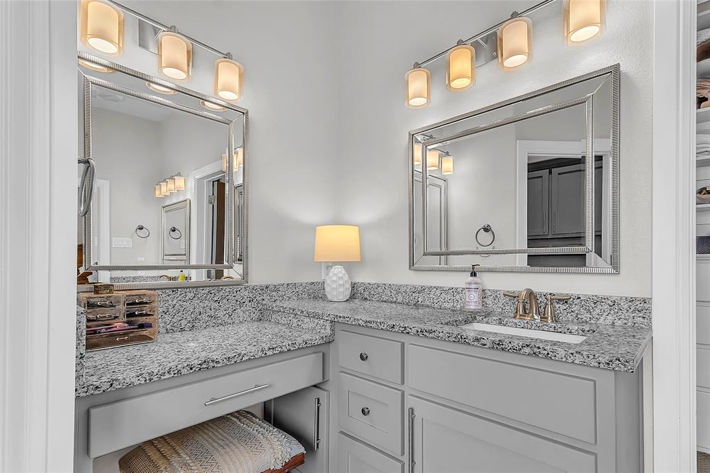 1014 Rennard Street Caddo Mills, TX 75135 - Photo 20 of 39 Primary Bathroom Dual vanity area featuring granite countertops, framed mirrors and decorative lighting
