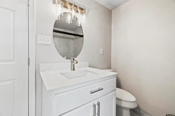 a bathroom with a toilet and a sink