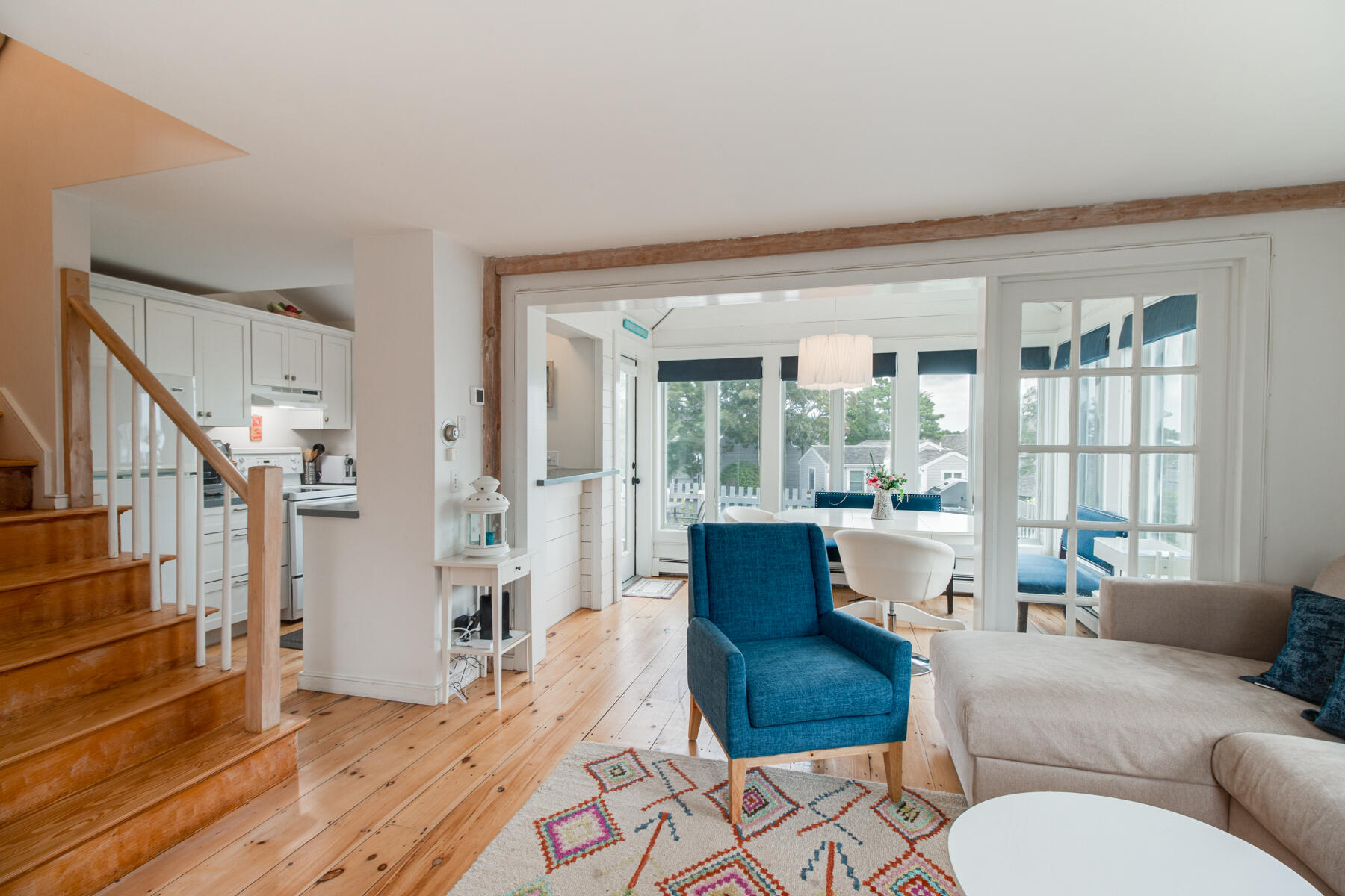 15 Brant Rock Road, Unit 765 Mashpee, MA 02649 - Photo 7 of 17 a living room with furniture and a large window