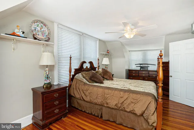 a bed room with a bed and a lamp