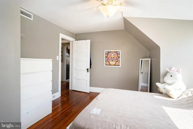 a bedroom with a bed and a couch