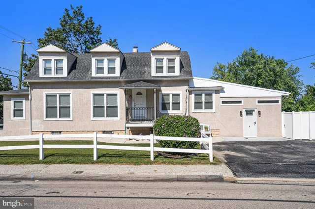 a house with trees in the background