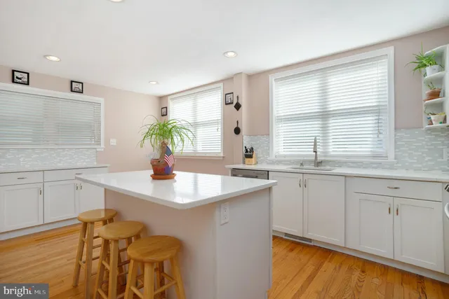 a kitchen with a sink cabinets and window