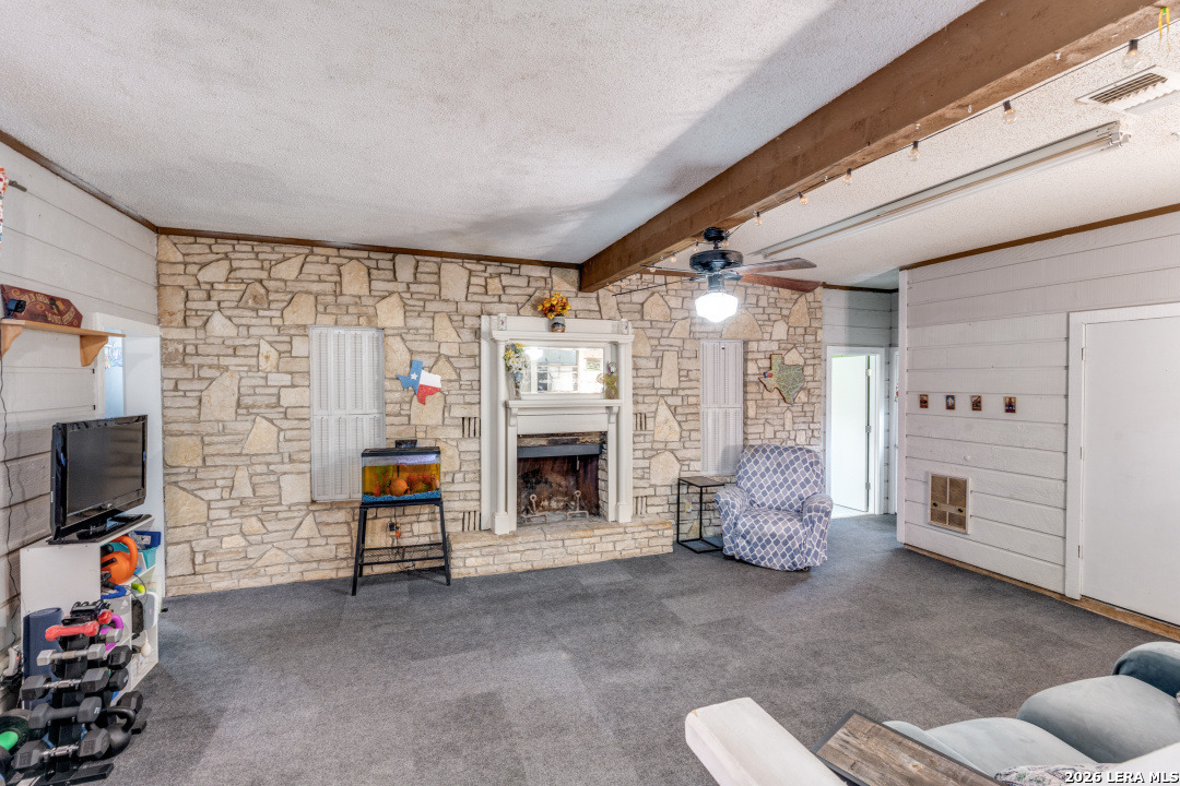914 6th Street Blanco, TX 78606 - Photo 11 of 26 a view of livingroom with furniture and a fireplace